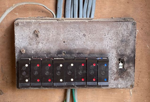 An old rewireable fuse board that should be replaced